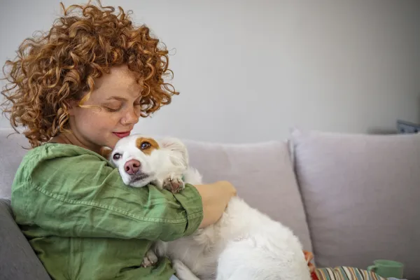 Why Does My Dog Prefer Sitting on You? Understanding Their Affectionate Behavior